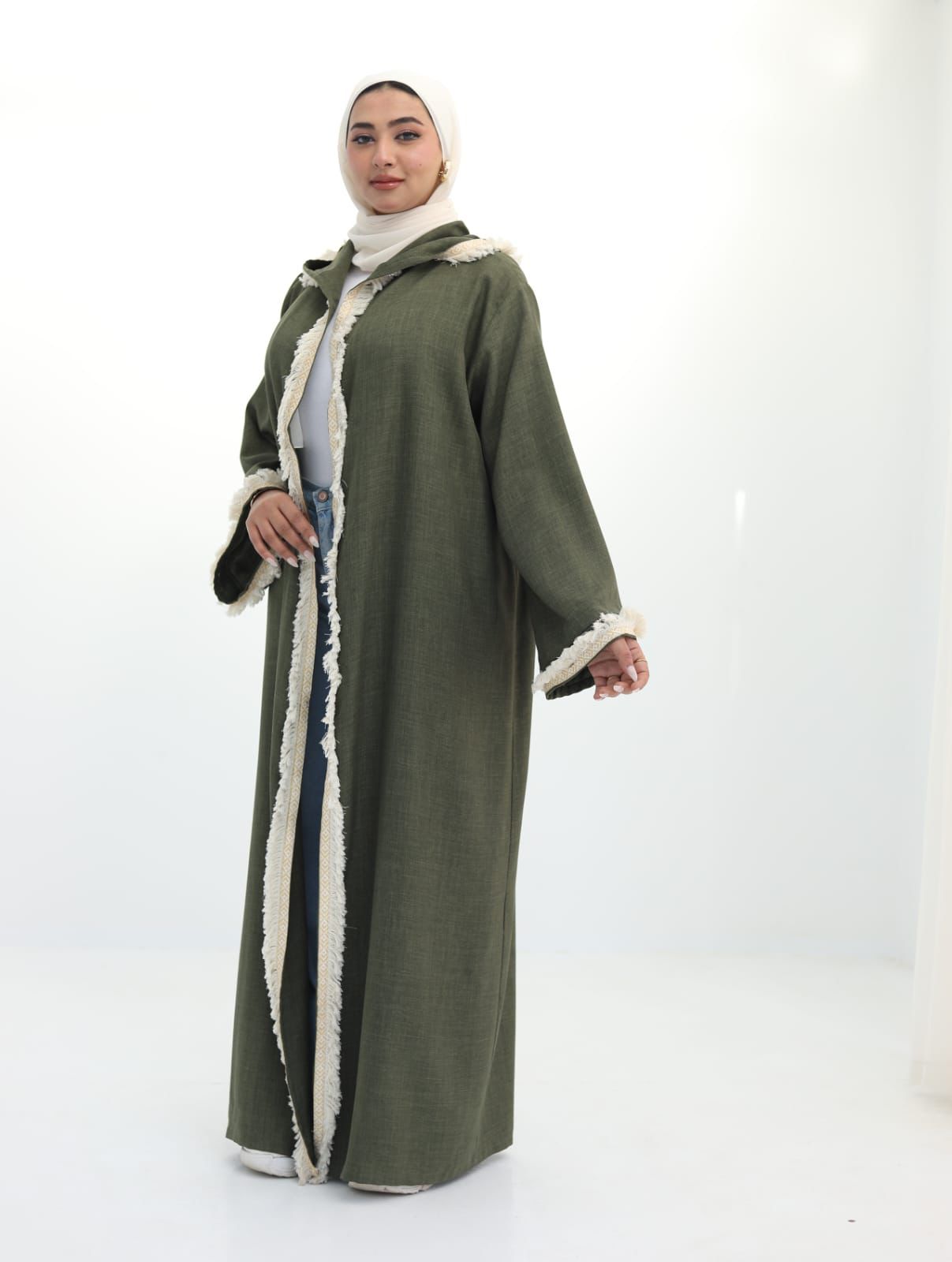 Olive green kaftan with off-white trim and a hood. ✨