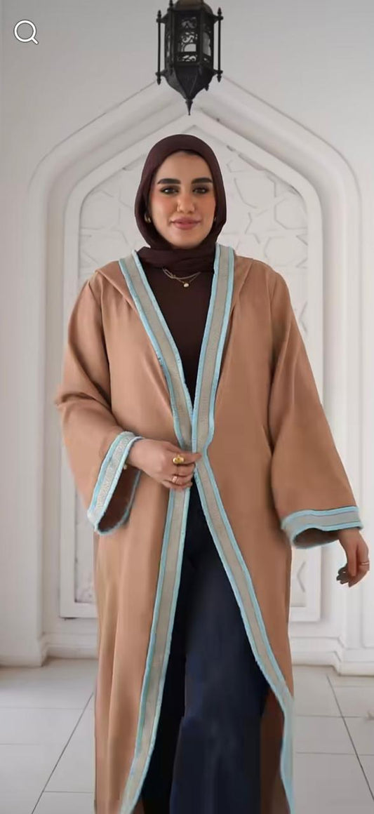 Beige kaftan with thin Arabic trim and a hood. ✨