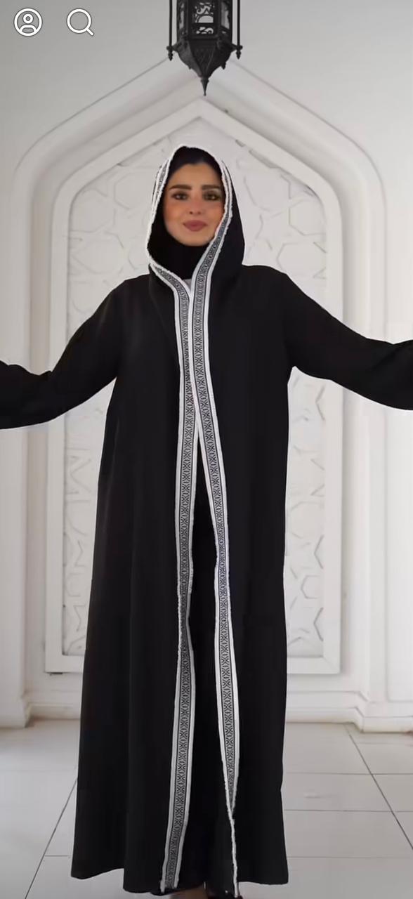 Black kaftan with thin Arabic trim and a hood. ✨