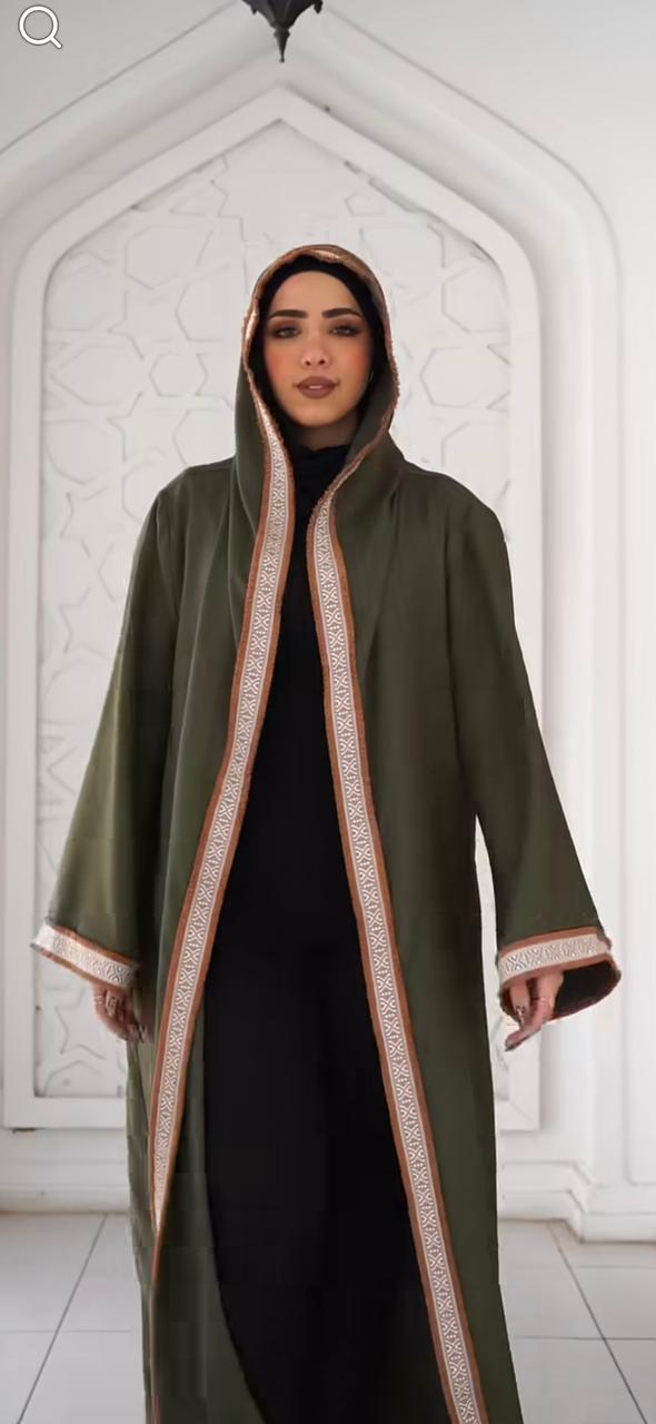 Olive kaftan with thin Arabic trim and a hood. ✨
