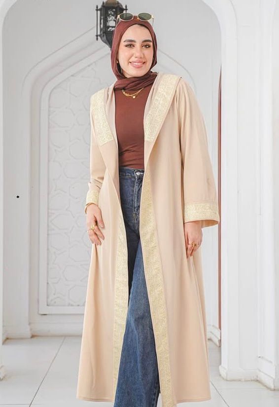 Beige kaftan with wide gold trim and a hood. ✨