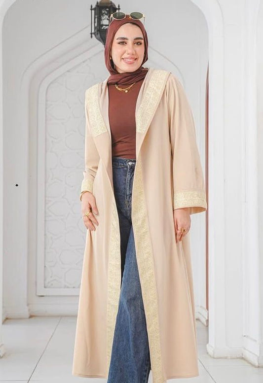 Beige kaftan with wide gold trim and a hood. ✨